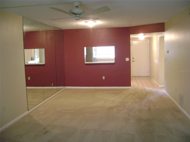 3077 Casa Del Sol Cir Unit 207, Clearwater, FL 33761 - carpeted spare room featuring ceiling fan and baseboards