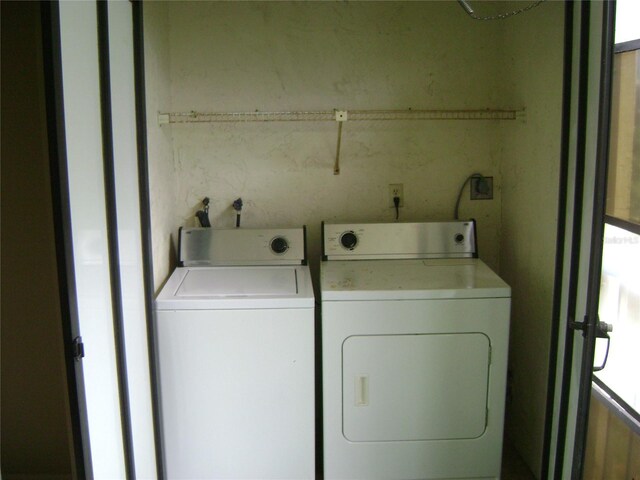 3077 Casa Del Sol Cir Unit 207, Clearwater, FL 33761 - washroom featuring washer and clothes dryer