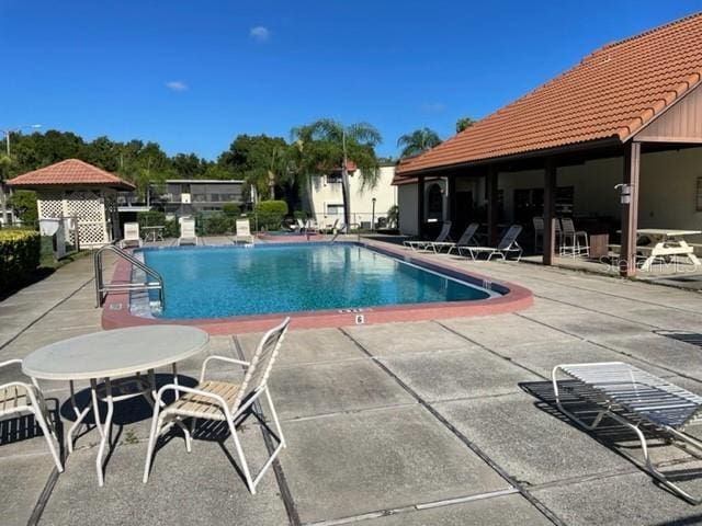 3077 Casa Del Sol Cir Unit 207, Clearwater, FL 33761 - community pool with a patio area