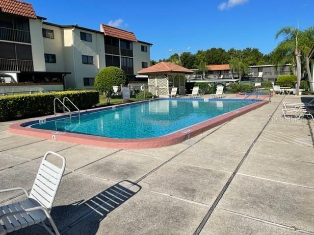 3077 Casa Del Sol Cir Unit 207, Clearwater, FL 33761 - community pool with a patio area