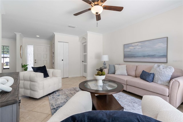 4706 Fox Hunt Dr, Tampa, FL 33624 - living area with ornamental molding, light tile patterned floors, a ceiling fan, and baseboards