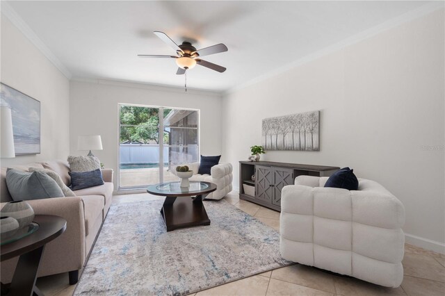 4706 Fox Hunt Dr, Tampa, FL 33624 - living area with ceiling fan, tile patterned floors, crown molding, and baseboards