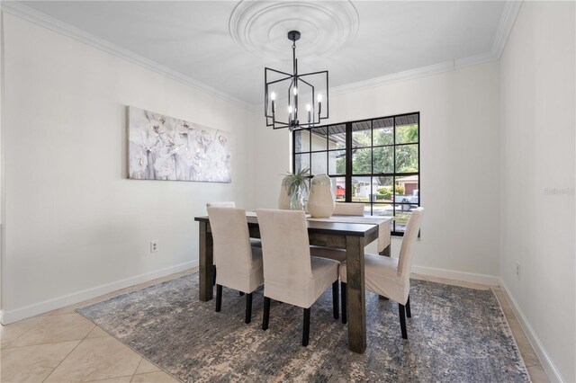 4706 Fox Hunt Dr, Tampa, FL 33624 - tiled dining area with ornamental molding, a chandelier, and baseboards