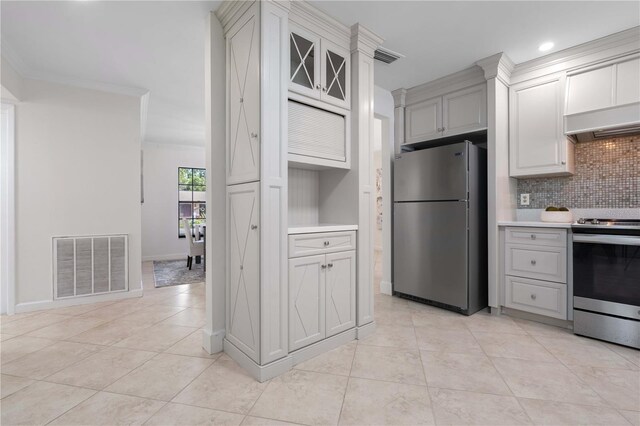 4706 Fox Hunt Dr, Tampa, FL 33624 - kitchen featuring stainless steel appliances, backsplash, light tile patterned floors, premium range hood, and light countertops
