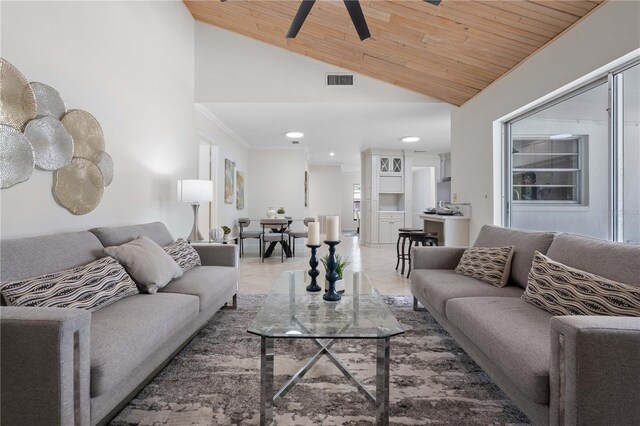 4706 Fox Hunt Dr, Tampa, FL 33624 - tiled living area featuring lofted ceiling, wood ceiling, ceiling fan, recessed lighting, and crown molding