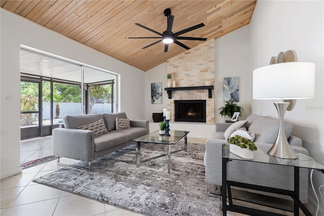 4706 Fox Hunt Dr, Tampa, FL 33624 - living area with wood ceiling, ceiling fan, tile patterned floors, high vaulted ceiling, and a stone fireplace