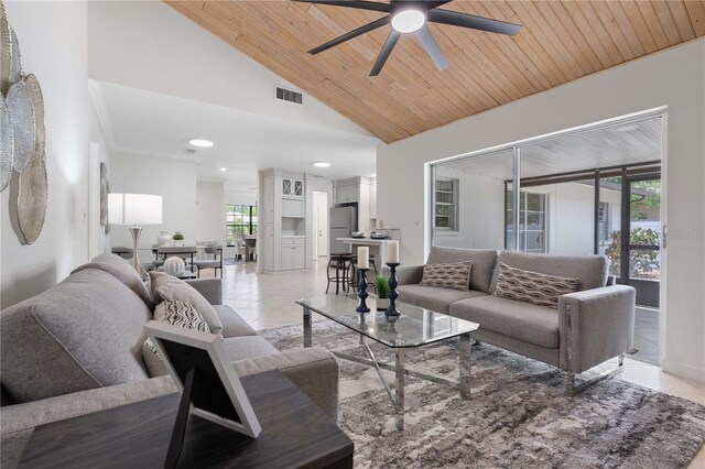 4706 Fox Hunt Dr, Tampa, FL 33624 - living area with a ceiling fan, light tile patterned floors, vaulted ceiling, recessed lighting, and wood ceiling