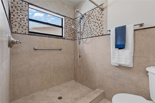 4706 Fox Hunt Dr, Tampa, FL 33624 - full bath with toilet, tiled shower, and tile walls