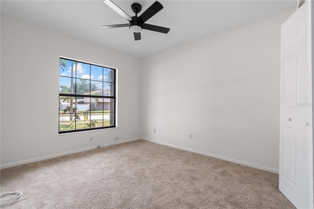 4706 Fox Hunt Dr, Tampa, FL 33624 - carpeted spare room featuring baseboards and ceiling fan