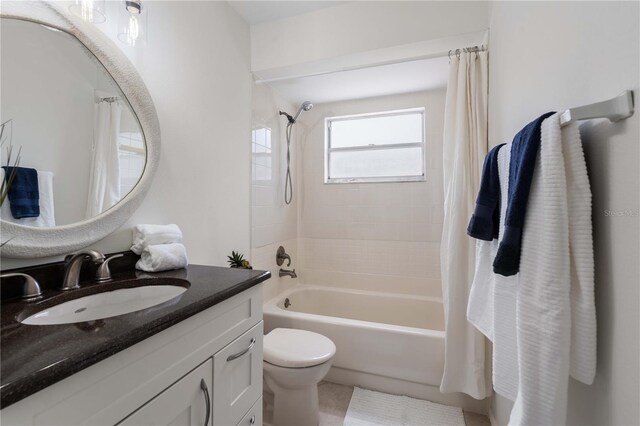 4706 Fox Hunt Dr, Tampa, FL 33624 - bathroom featuring shower / bath combo, vanity, and toilet