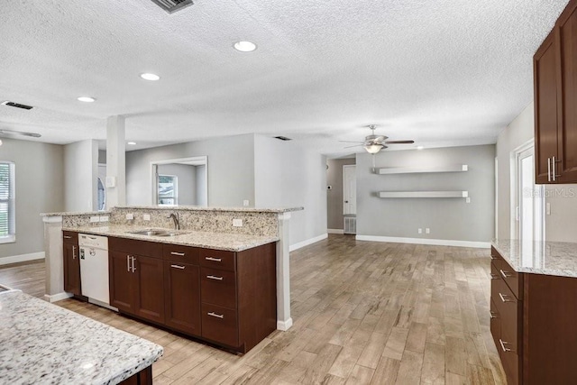 3917 Casaba Loop, Valrico, FL 33596 - kitchen featuring white dishwasher, a ceiling fan, a sink, a textured ceiling, and light wood-style flooring