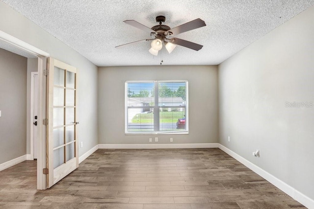 3917 Casaba Loop, Valrico, FL 33596 - spare room featuring wood finished floors, a textured ceiling, ceiling fan, and baseboards