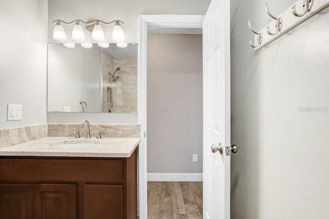 3917 Casaba Loop, Valrico, FL 33596 - full bath featuring vanity, wood finished floors, a shower, and baseboards