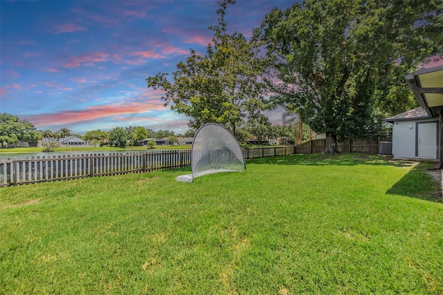 2016 Chelam Way, Brandon, FL 33511 - yard at dusk featuring a water view