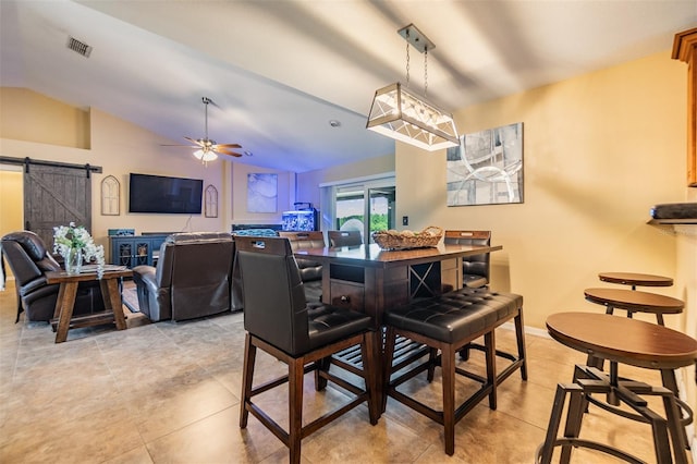 2016 Chelam Way, Brandon, FL 33511 - dining room featuring a barn door, light tile patterned floors, ceiling fan, and lofted ceiling