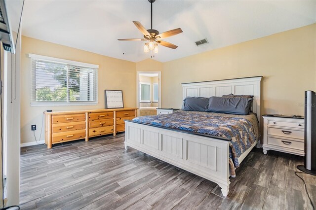 2016 Chelam Way, Brandon, FL 33511 - bedroom with dark wood finished floors, vaulted ceiling, baseboards, and ceiling fan