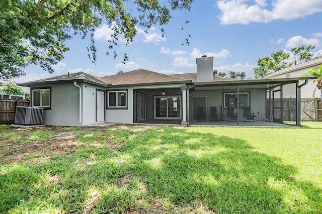 2016 Chelam Way, Brandon, FL 33511 - back of property featuring a chimney, a sunroom, and stucco siding
