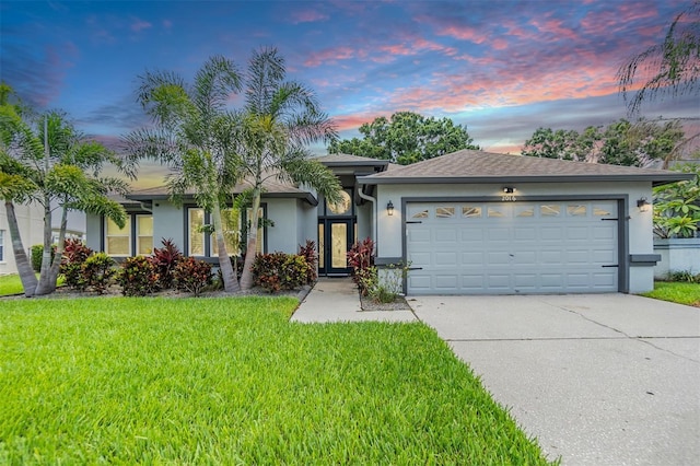 2016 Chelam Way, Brandon, FL 33511 - single story home with stucco siding, concrete driveway, an attached garage, and a yard
