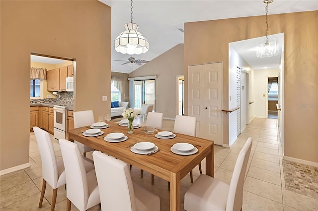 1604 Comfy Ct, Sun City Center, FL 33573 - dining space featuring light tile patterned floors, a chandelier, a ceiling fan, baseboards, and lofted ceiling