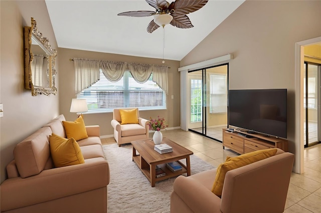 1604 Comfy Ct, Sun City Center, FL 33573 - living area featuring lofted ceiling, a ceiling fan, light tile patterned floors, and baseboards