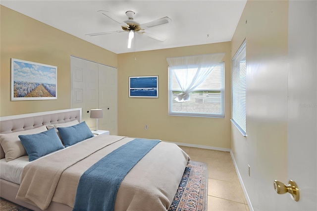 1604 Comfy Ct, Sun City Center, FL 33573 - bedroom featuring multiple windows, baseboards, ceiling fan, and light tile patterned floors