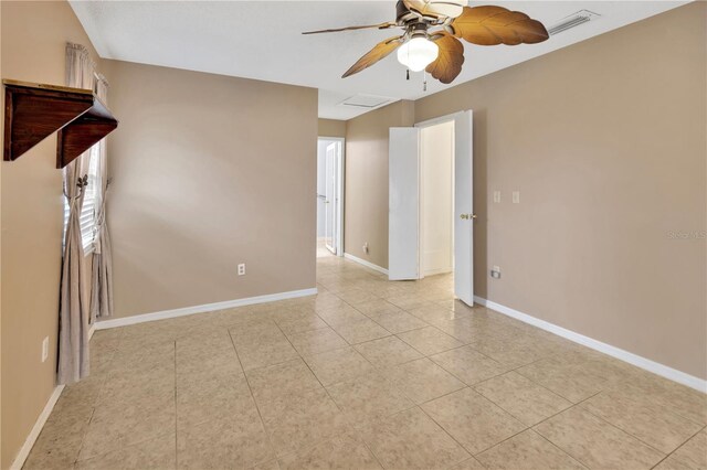1604 Comfy Ct, Sun City Center, FL 33573 - empty room with ceiling fan, light tile patterned floors, and baseboards