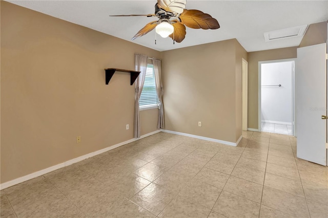 1604 Comfy Ct, Sun City Center, FL 33573 - empty room with a ceiling fan, baseboards, light tile patterned flooring, and attic access