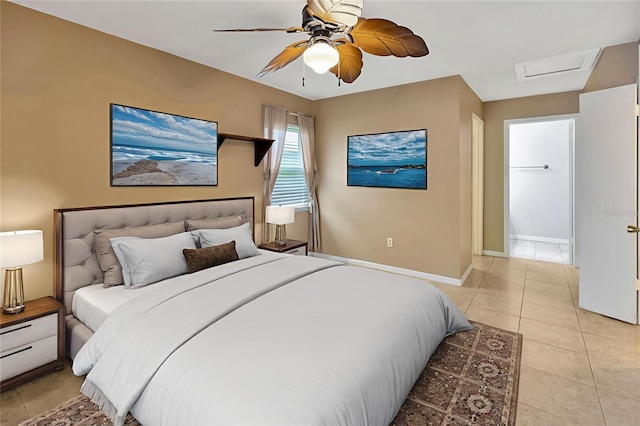 1604 Comfy Ct, Sun City Center, FL 33573 - bedroom with baseboards, light tile patterned floors, a ceiling fan, and attic access