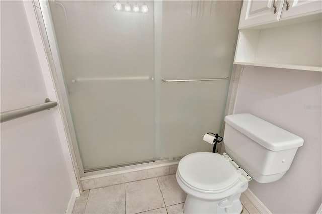 1604 Comfy Ct, Sun City Center, FL 33573 - full bath with a stall shower, toilet, baseboards, and tile patterned floors