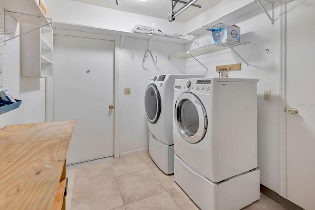 1604 Comfy Ct, Sun City Center, FL 33573 - washroom with separate washer and dryer and light tile patterned flooring
