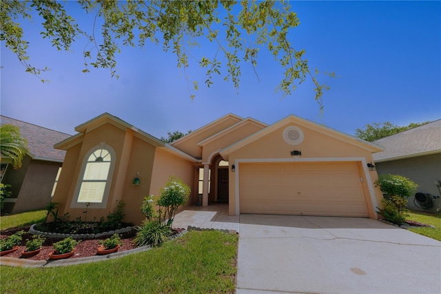 9852 Laurel Ledge Dr, Riverview, FL 33569 - ranch-style house with stucco siding, a garage, and concrete driveway
