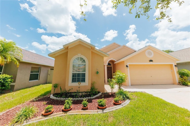 9852 Laurel Ledge Dr, Riverview, FL 33569 - mediterranean / spanish home featuring stucco siding, a garage, driveway, and a front lawn