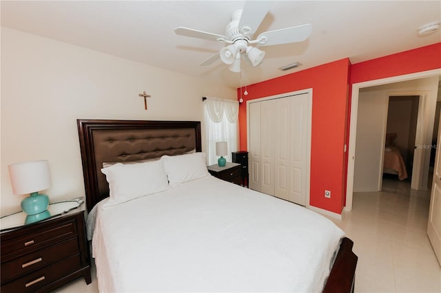 9852 Laurel Ledge Dr, Riverview, FL 33569 - bedroom featuring a closet, ceiling fan, and light tile patterned floors