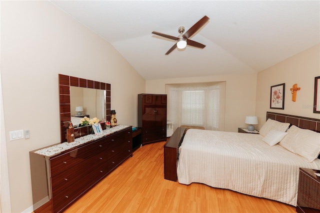 9852 Laurel Ledge Dr, Riverview, FL 33569 - bedroom with vaulted ceiling, light wood-type flooring, and a ceiling fan