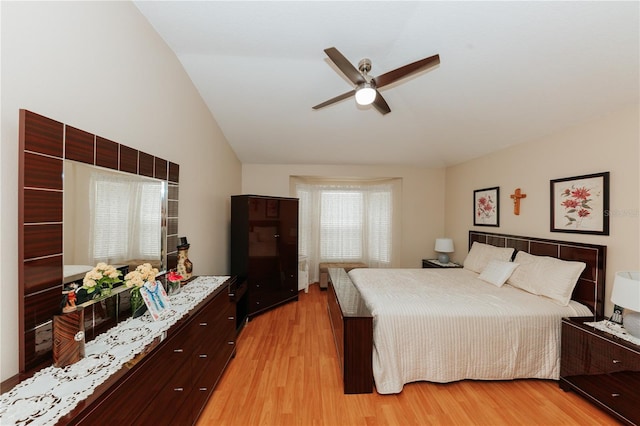 9852 Laurel Ledge Dr, Riverview, FL 33569 - bedroom featuring vaulted ceiling, light wood finished floors, and a ceiling fan