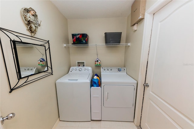 9852 Laurel Ledge Dr, Riverview, FL 33569 - laundry area featuring washer and clothes dryer and light tile patterned flooring