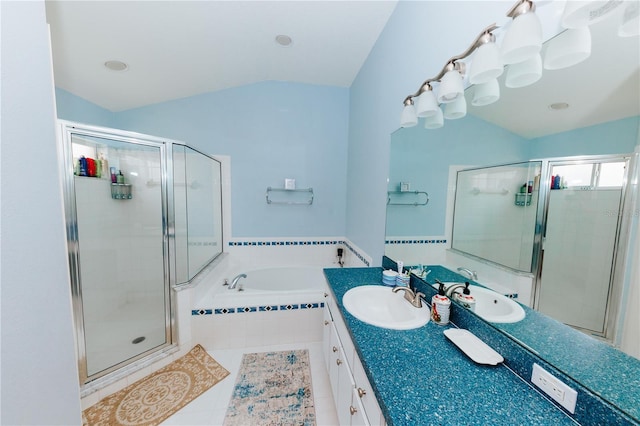 9852 Laurel Ledge Dr, Riverview, FL 33569 - full bathroom with lofted ceiling, a shower stall, vanity, a garden tub, and tile patterned floors