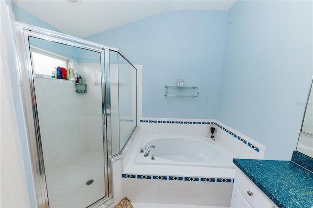 9852 Laurel Ledge Dr, Riverview, FL 33569 - bathroom with a bath, vanity, lofted ceiling, and a shower stall
