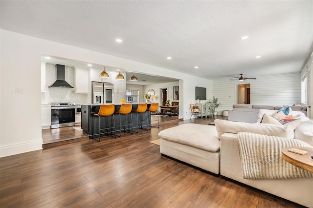 3120 S Polk Ave, Lakeland, FL 33803 - living room with dark wood-type flooring, a ceiling fan, recessed lighting, and baseboards