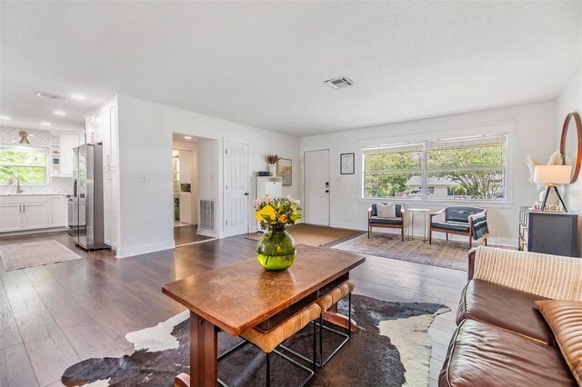 3120 S Polk Ave, Lakeland, FL 33803 - living room featuring dark wood-type flooring, baseboards, and recessed lighting