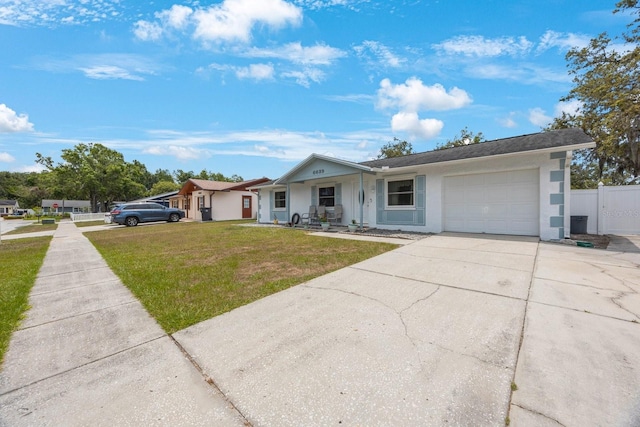 6639 Winding Oak Dr, Tampa, FL 33625 - ranch-style house with a garage, concrete driveway, stucco siding, and a porch