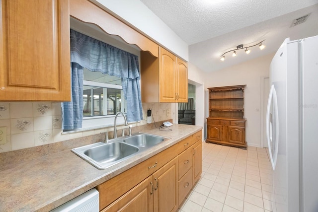 6639 Winding Oak Dr, Tampa, FL 33625 - kitchen featuring white appliances, a sink, light tile patterned floors, backsplash, and light countertops