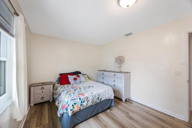 6639 Winding Oak Dr, Tampa, FL 33625 - bedroom featuring wood finished floors and baseboards