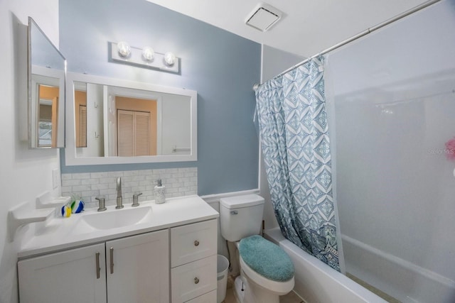 6639 Winding Oak Dr, Tampa, FL 33625 - bathroom featuring decorative backsplash, toilet, vanity, and shower / tub combo with curtain