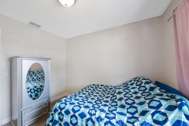 6639 Winding Oak Dr, Tampa, FL 33625 - bedroom featuring wood finished floors and baseboards