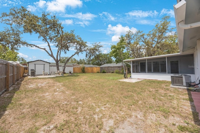 6639 Winding Oak Dr, Tampa, FL 33625 - view of yard with central AC and a sunroom
