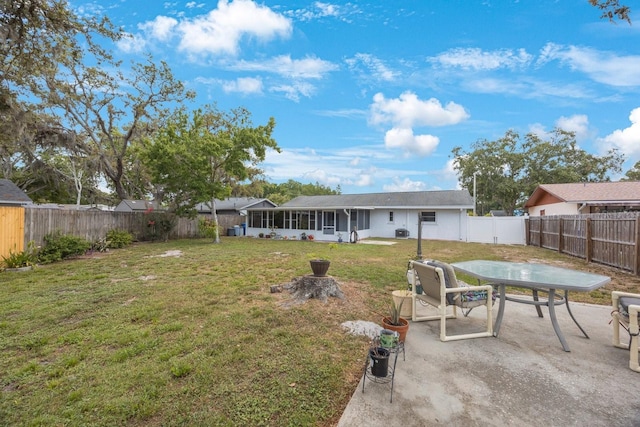 6639 Winding Oak Dr, Tampa, FL 33625 - view of yard with a sunroom, a patio, and outdoor dining area