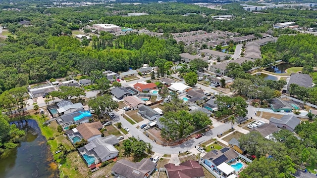 6639 Winding Oak Dr, Tampa, FL 33625 - aerial view of property's location featuring a large body of water and nearby suburban area