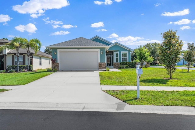 11016 Kiskadee Cir, New Port Richey, FL 34654 - view of front of house with an attached garage, a front lawn, concrete driveway, stone siding, and stucco siding