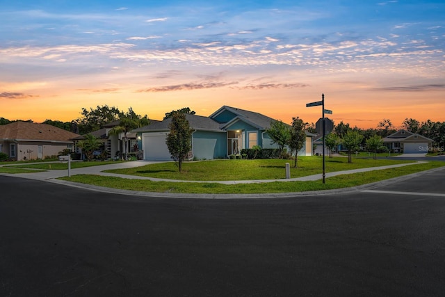 11016 Kiskadee Cir, New Port Richey, FL 34654 - single story home featuring concrete driveway, a garage, a yard, and stucco siding